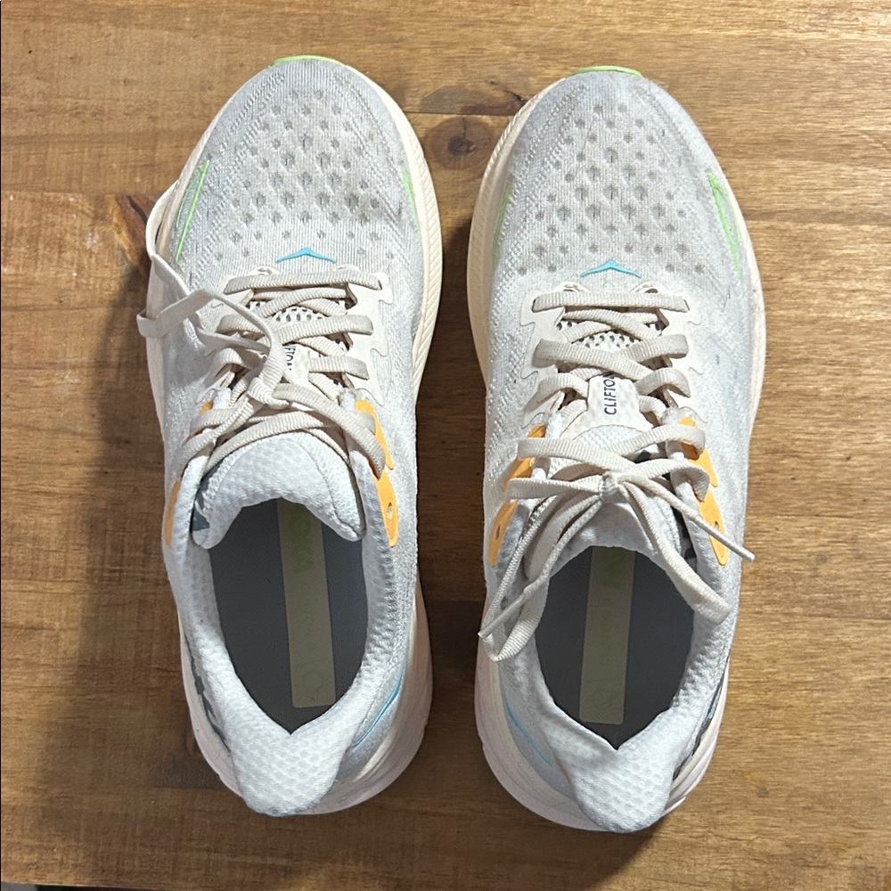 HOKA Clifton 9s White and Gray Athletic Sneakers with Yellow Accents